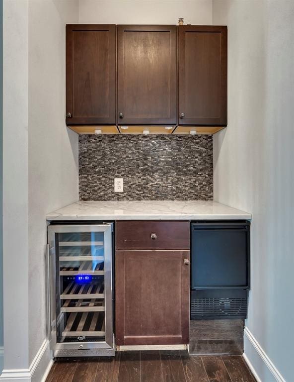 1231 Fawndale Dr NW, Kennesaw, GA 30152 - indoor dry bar featuring beverage cooler, dark wood finished floors, backsplash, and baseboards