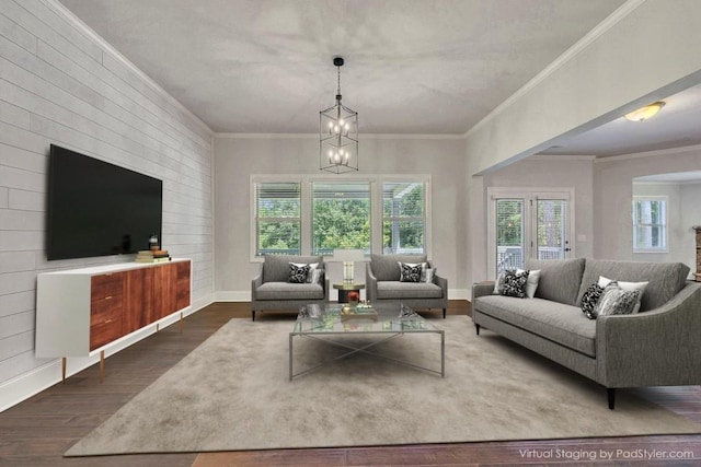 1231 Fawndale Dr NW, Kennesaw, GA 30152 - living area featuring plenty of natural light, wood finished floors, a chandelier, ornamental molding, and baseboards