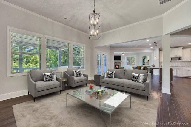 1231 Fawndale Dr NW, Kennesaw, GA 30152 - living area with wood finished floors, baseboards, ornamental molding, a chandelier, and ceiling fan