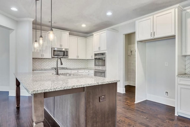 1231 Fawndale Dr NW, Kennesaw, GA 30152 - kitchen with appliances with stainless steel finishes, baseboards, backsplash, dark wood-style flooring, and light stone countertops