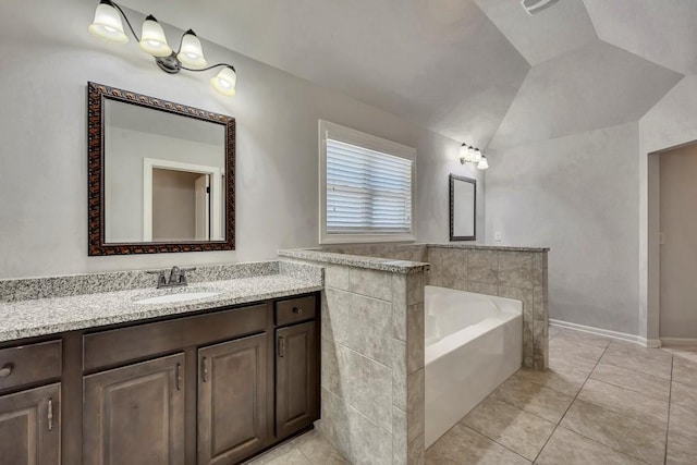 1231 Fawndale Dr NW, Kennesaw, GA 30152 - bathroom featuring a bath, vanity, tile patterned floors, lofted ceiling, and baseboards