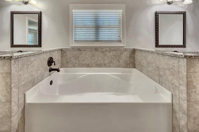 1231 Fawndale Dr NW, Kennesaw, GA 30152 - bathroom with a garden tub and tile walls