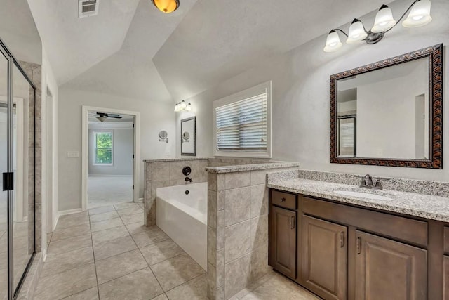 1231 Fawndale Dr NW, Kennesaw, GA 30152 - bathroom with vaulted ceiling, tile patterned floors, a bath, vanity, and a ceiling fan