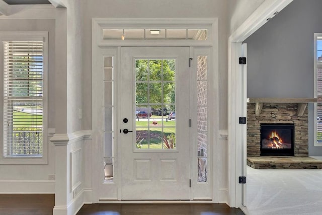1231 Fawndale Dr NW, Kennesaw, GA 30152 - entryway featuring a stone fireplace, baseboards, and dark wood-style flooring