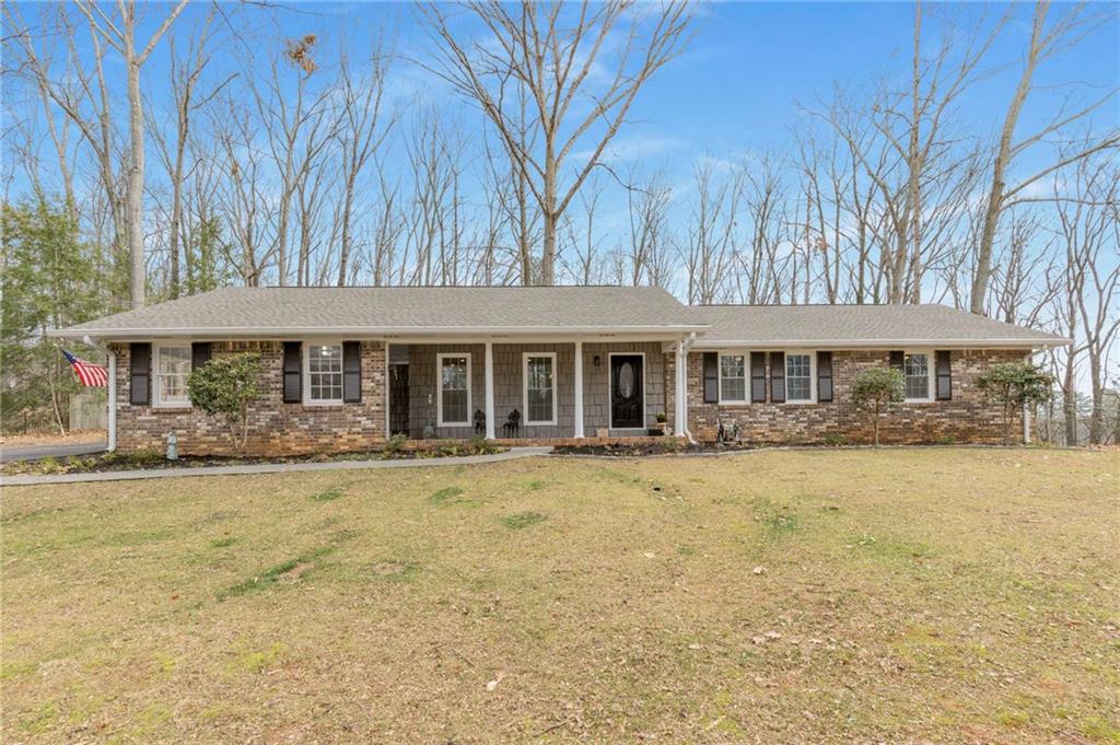 3374 Timber Lake Rd NW, Kennesaw, GA 30144 - single story home featuring a front yard and covered porch