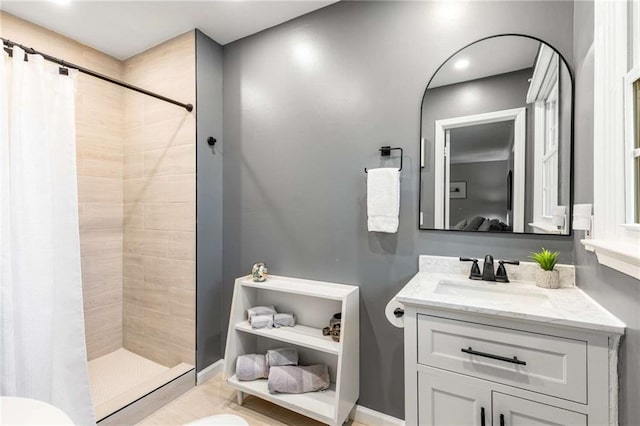 bathroom featuring vanity and a shower with shower curtain