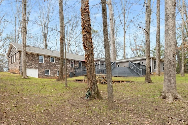 exterior space featuring a yard and a deck