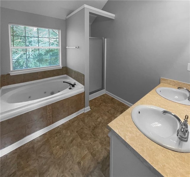 bathroom featuring vaulted ceiling, plus walk in shower, and vanity