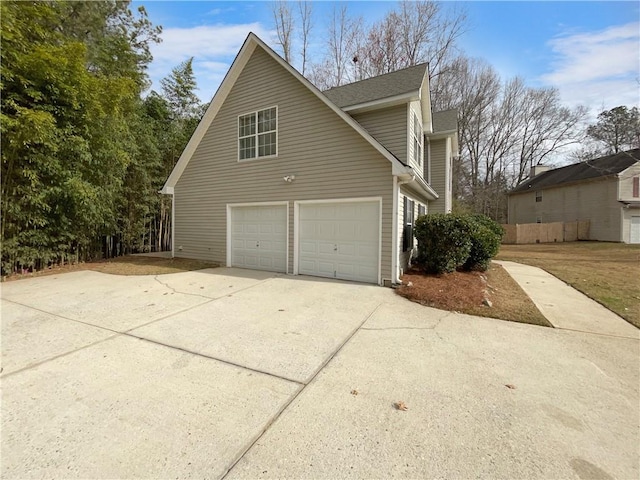 view of side of home featuring a garage