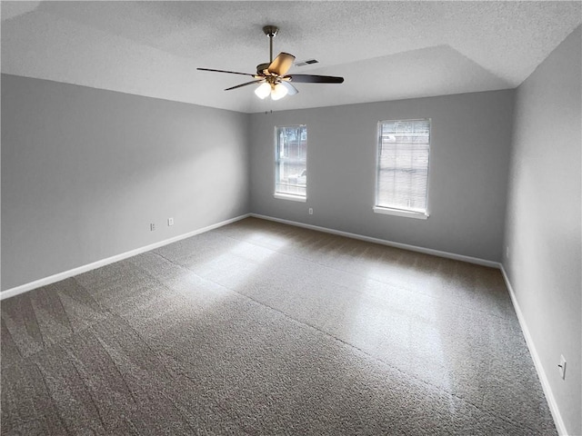 spare room with a textured ceiling and ceiling fan