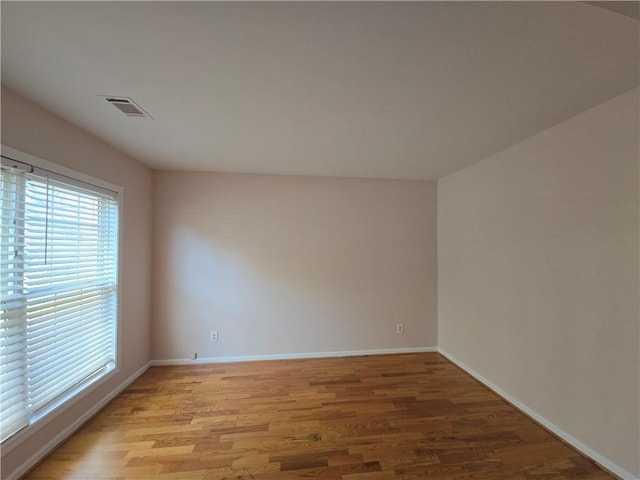 spare room featuring light hardwood / wood-style flooring