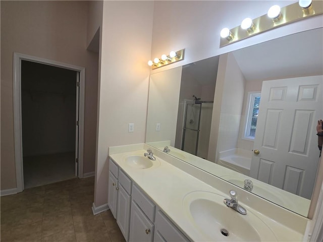 bathroom with tile patterned floors, independent shower and bath, and vanity