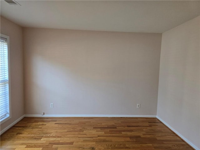 spare room featuring light hardwood / wood-style floors