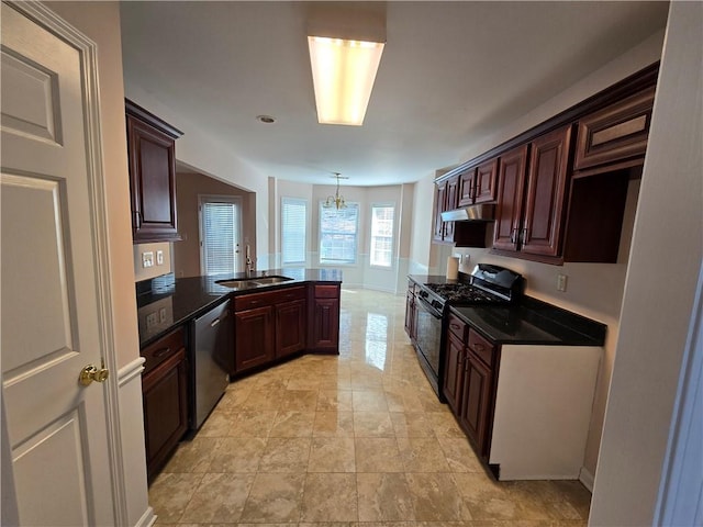 kitchen featuring pendant lighting, sink, a chandelier, stainless steel dishwasher, and gas stove