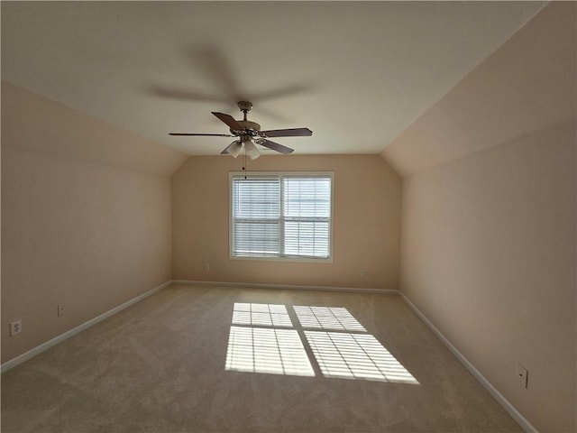 additional living space featuring vaulted ceiling, ceiling fan, and carpet