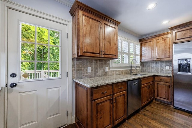 2668 Jefferson Ter, East Point, GA 30344 - kitchen with stainless steel appliances, crown molding, a sink, dark wood finished floors, and brown cabinetry