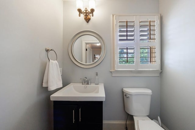 2668 Jefferson Ter, East Point, GA 30344 - bathroom with toilet, vanity, and baseboards