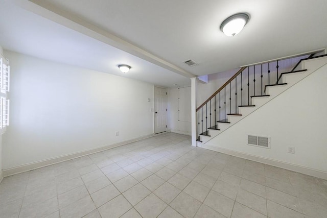2668 Jefferson Ter, East Point, GA 30344 - basement featuring stairway, baseboards, and light tile patterned flooring