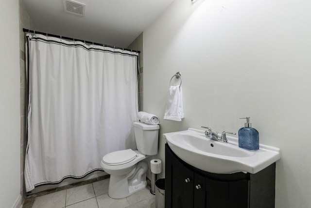 2668 Jefferson Ter, East Point, GA 30344 - bathroom with toilet, vanity, tile patterned flooring, and a shower with shower curtain