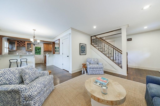 2668 Jefferson Ter, East Point, GA 30344 - living room with a chandelier, dark wood-style flooring, stairway, ornamental molding, and baseboards