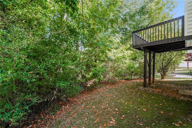 view of yard featuring a wooden deck