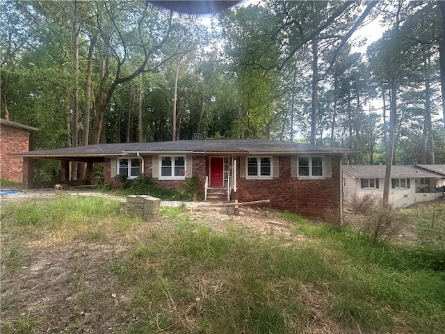 481 Hammond Dr, Atlanta, GA 30328 - ranch-style home featuring brick siding and an attached carport