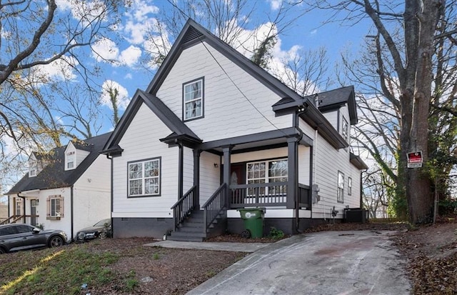 view of front of home featuring central AC unit and a porch