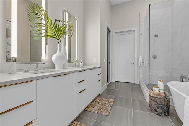 bathroom featuring vanity, separate shower and tub, tile patterned flooring, and plenty of natural light