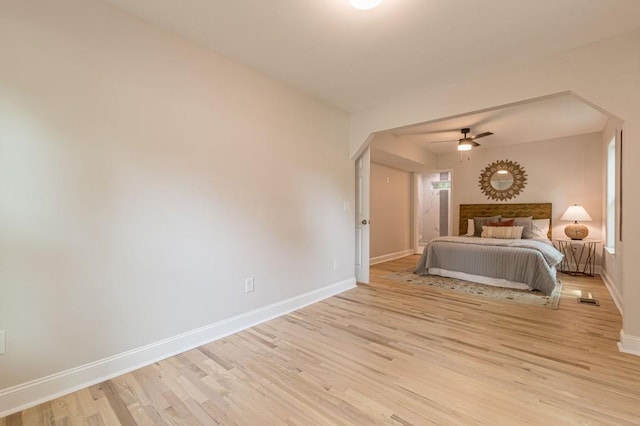 unfurnished bedroom featuring baseboards and light wood finished floors