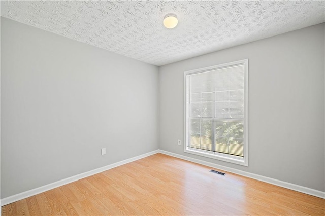 94 Park Ave W, Dallas, GA 30157 - empty room featuring wood finished floors and a textured ceiling