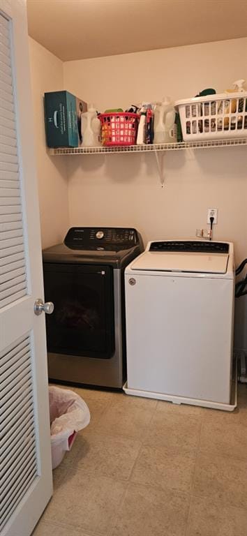 washroom featuring washer and dryer