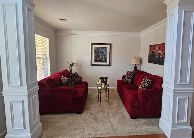 living room featuring light colored carpet, crown molding, and ornate columns