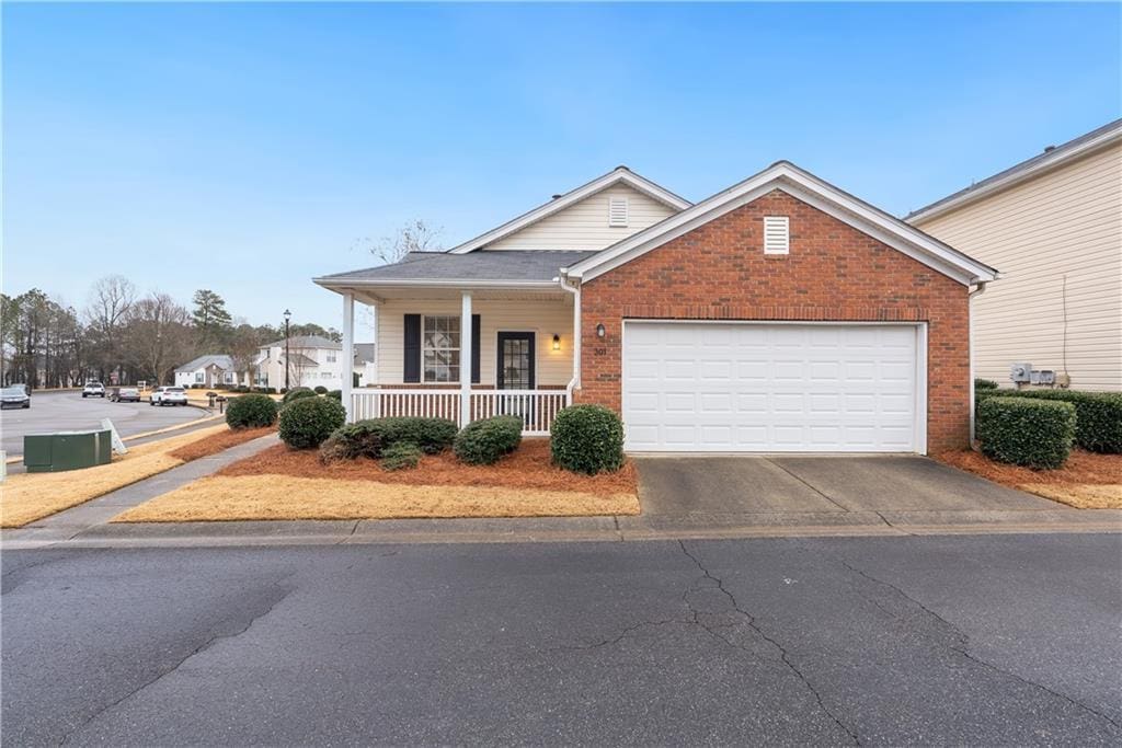 view of front of house with a garage and covered porch