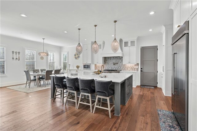 109 Owens Mill Pl, Canton, GA 30115 - kitchen with a sink, light wood-type flooring, gray cabinetry, light countertops, and appliances with stainless steel finishes