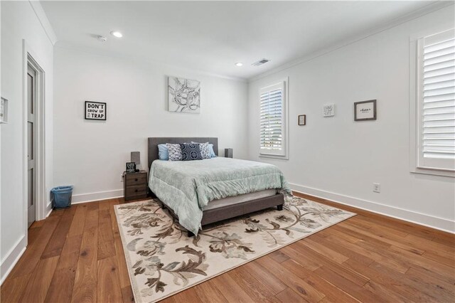 109 Owens Mill Pl, Canton, GA 30115 - bedroom with multiple windows, baseboards, wood finished floors, and crown molding