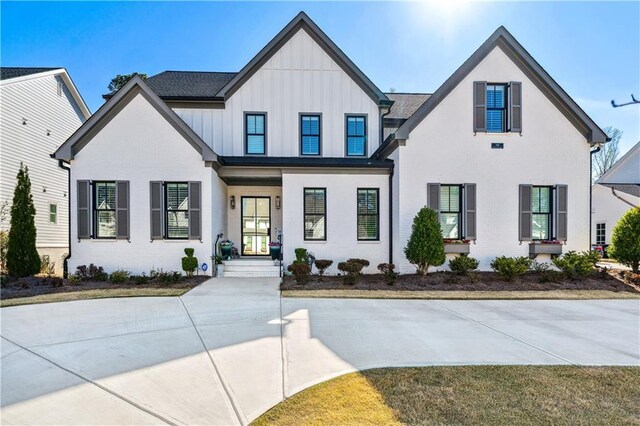 109 Owens Mill Pl, Canton, GA 30115 - hallway with a decorative wall, crown molding, stairs, light wood-type flooring, and a notable chandelier