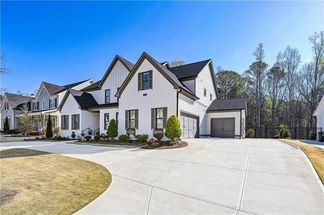 109 Owens Mill Pl, Canton, GA 30115 - modern farmhouse style home with a residential view, driveway, fence, an attached garage, and board and batten siding