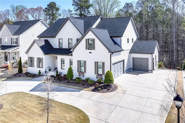 109 Owens Mill Pl, Canton, GA 30115 - modern farmhouse style home featuring driveway, board and batten siding, a shingled roof, and a garage