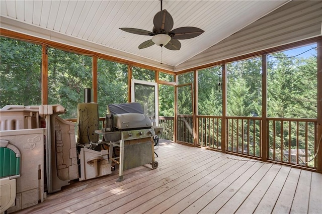 sunroom featuring vaulted ceiling and ceiling fan