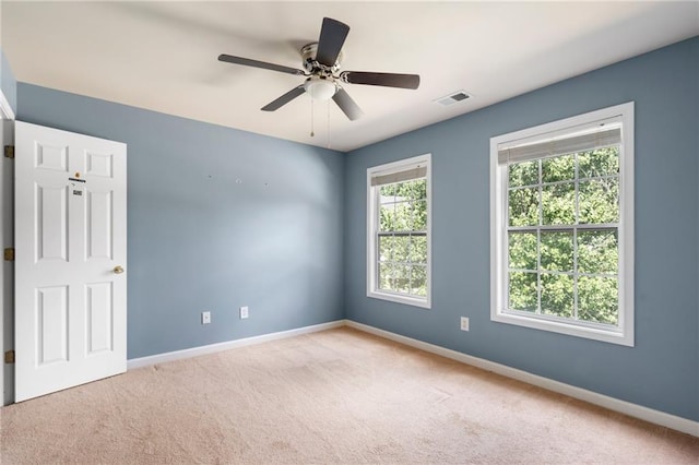 carpeted empty room with ceiling fan