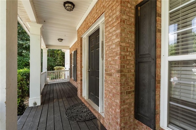 wooden terrace with a porch