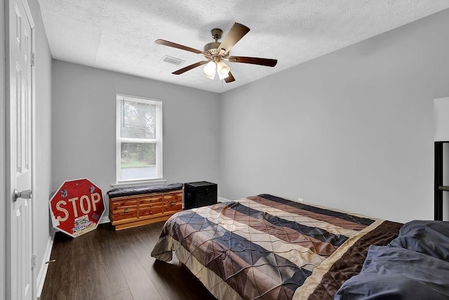 5461 Forest Path Ct, Stone Mountain, GA 30088 - bedroom with dark wood finished floors, a textured ceiling, a ceiling fan, and baseboards
