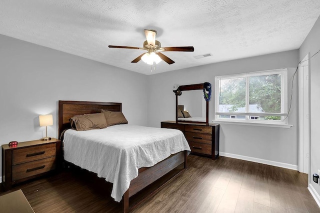 5461 Forest Path Ct, Stone Mountain, GA 30088 - bedroom with baseboards, dark wood finished floors, a textured ceiling, and ceiling fan