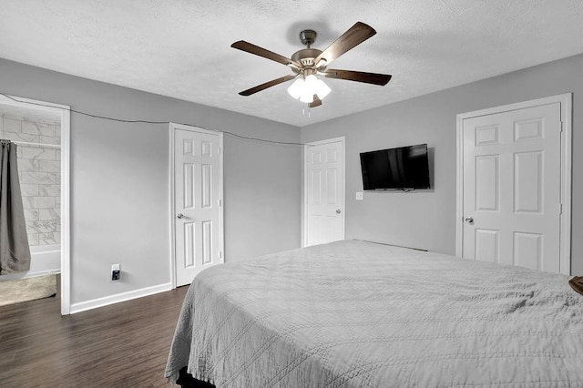 5461 Forest Path Ct, Stone Mountain, GA 30088 - bedroom with dark wood-type flooring, baseboards, a textured ceiling, and a ceiling fan
