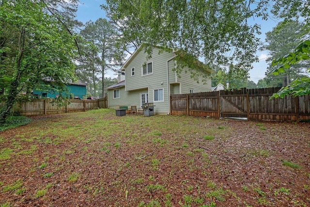 5461 Forest Path Ct, Stone Mountain, GA 30088 - back of house with a fenced backyard