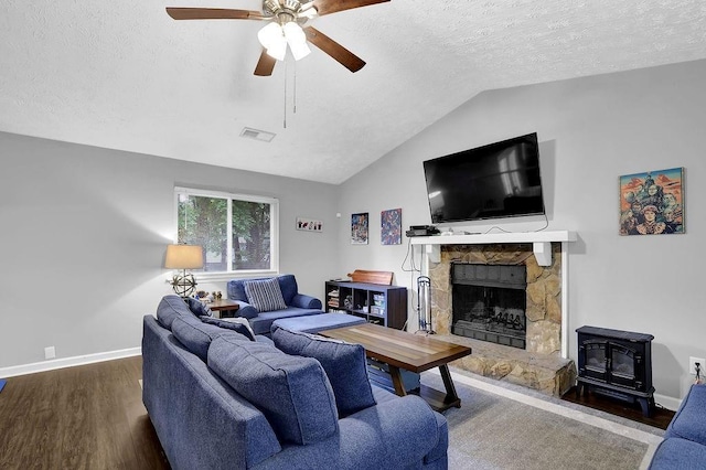 5461 Forest Path Ct, Stone Mountain, GA 30088 - living room featuring wood finished floors, baseboards, a ceiling fan, vaulted ceiling, and a textured ceiling
