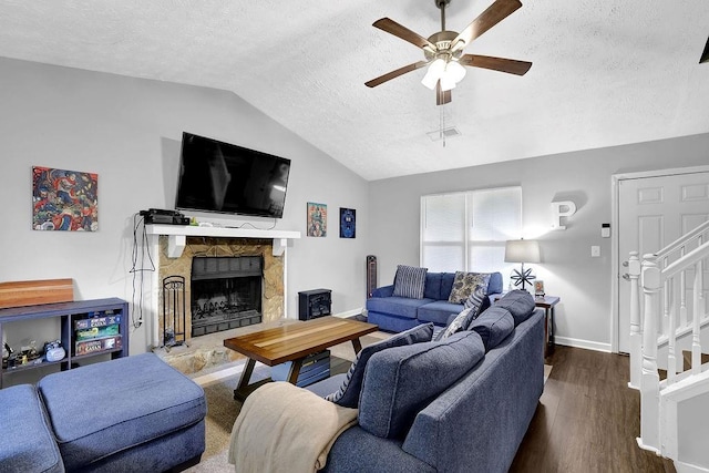5461 Forest Path Ct, Stone Mountain, GA 30088 - living room with vaulted ceiling, a textured ceiling, ceiling fan, baseboards, and wood finished floors