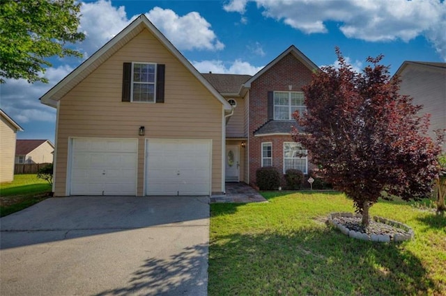 view of property with a garage and a front yard