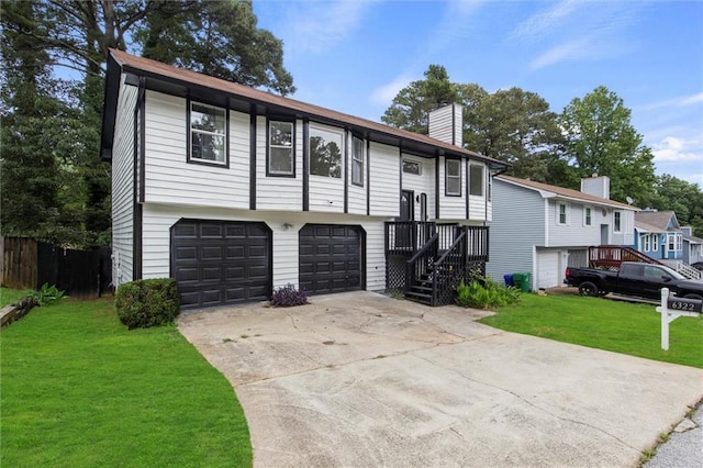 6322 Phillips Creek Dr, Lithonia, GA 30058 - raised ranch with a chimney, an attached garage, a front lawn, and driveway