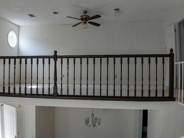 904 Bridge Ln SE, Smyrna, GA 30082 - stairway featuring ceiling fan and a chandelier